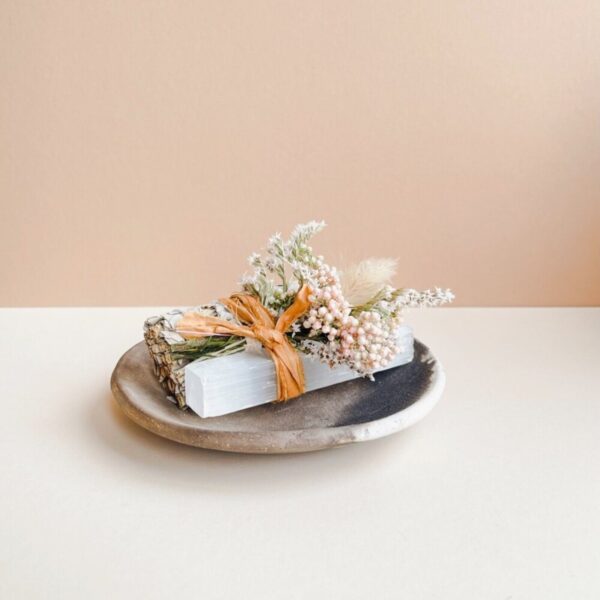 Energy Cleansing gift for modern mystics with a selenite crystal, dried flowers, and sage wrapped in a beautiful cotton bow.